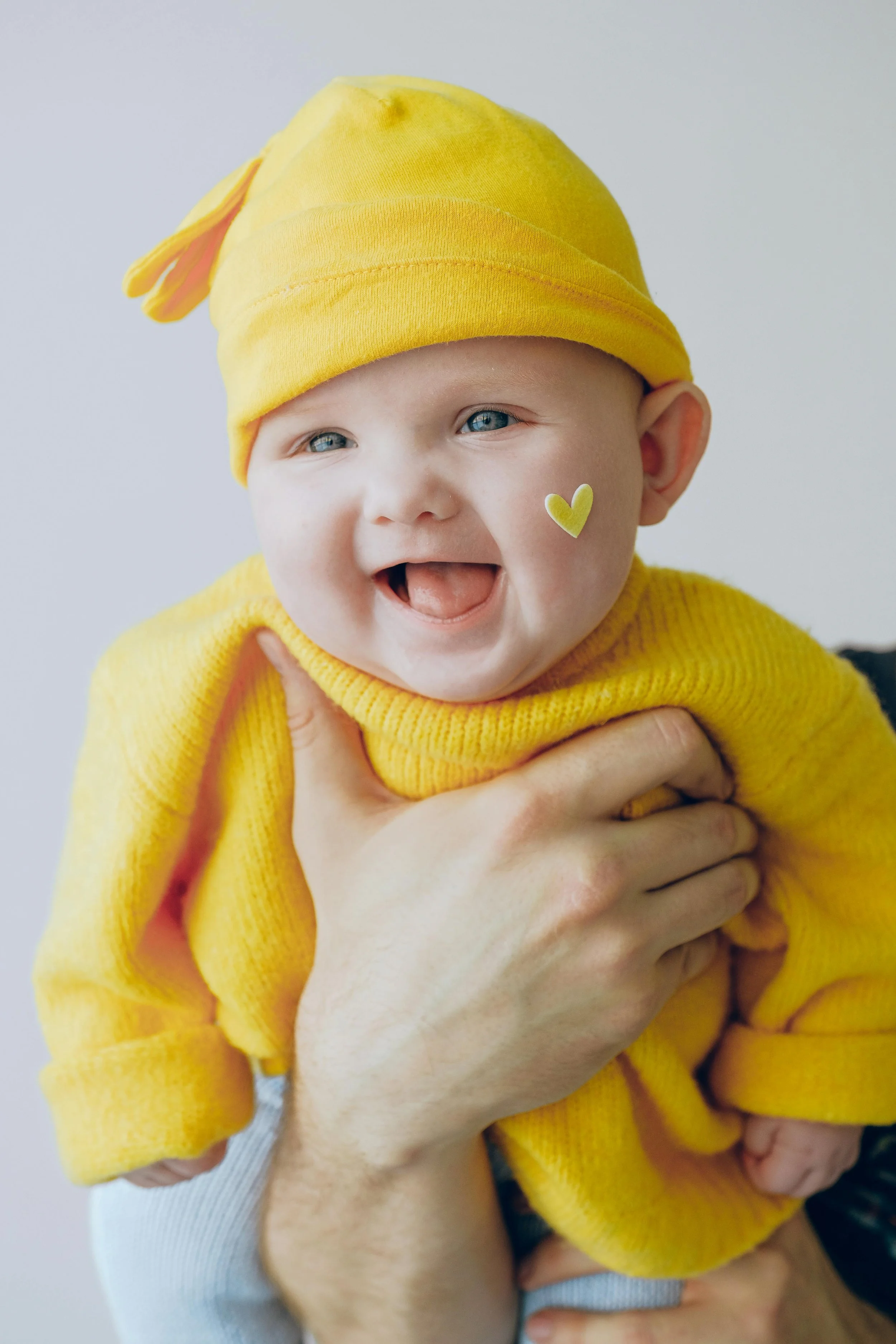 Baby in yellow clothes