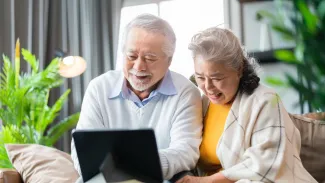 Retired Senior couple sitting on a sofa couch